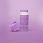 Load image into Gallery viewer, Purple bottle of sunscreen on a purple background.
